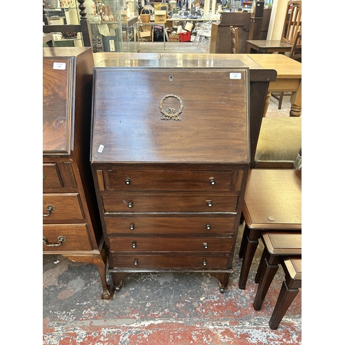 144 - An Edwardian mahogany bureau on bracket supports and casters - approx. 101cm high x 54cm wide x 38cm... 