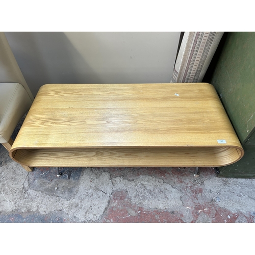 163 - A mid 20th century style oak veneer and bentwood coffee table on chrome plated supports - approx. 45... 