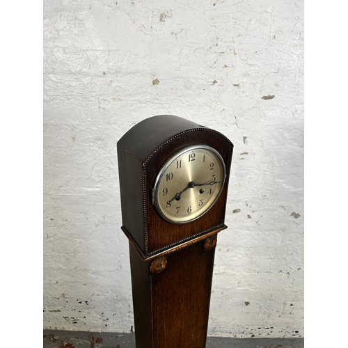 171 - A 1930s oak cased granddaughter clock - approx. 127cm high