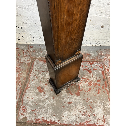 171 - A 1930s oak cased granddaughter clock - approx. 127cm high