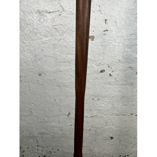 176 - A mid 20th century teak standard lamp - approx. 121cm high