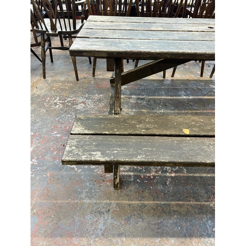 178 - A wooden picnic bench - approx. 68cm high x 129cm wide x 152cm long