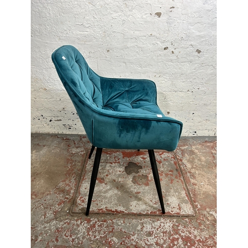 180 - A contemporary teal fabric upholstered dining chair