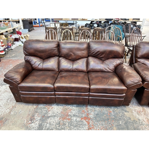 184 - A modern brown leather reclining two piece lounge suite comprising three seater sofa and arm chair