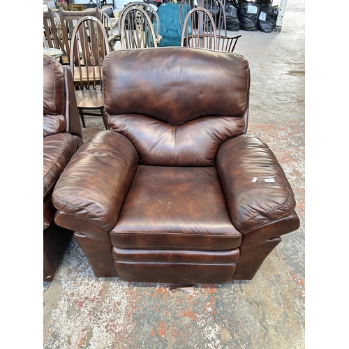 184 - A modern brown leather reclining two piece lounge suite comprising three seater sofa and arm chair