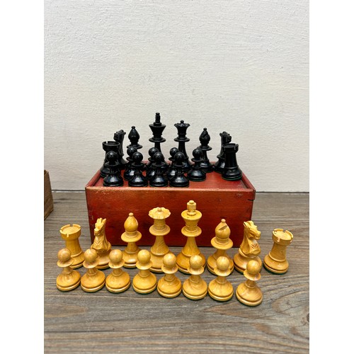 386 - Two vintage complete carved boxwood and ebony chess sets