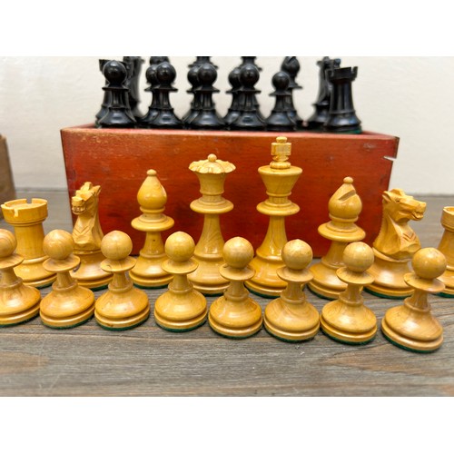 386 - Two vintage complete carved boxwood and ebony chess sets