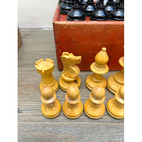 386 - Two vintage complete carved boxwood and ebony chess sets