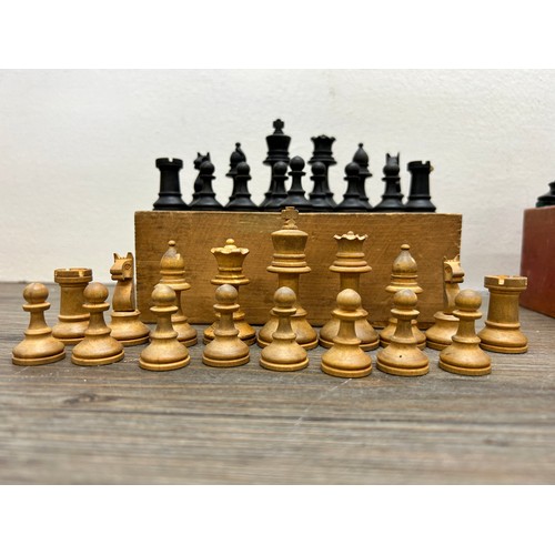 386 - Two vintage complete carved boxwood and ebony chess sets