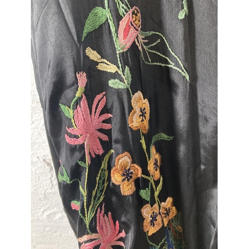 399 - A vintage Japanese embroidered silk kimono with floral and peacock design