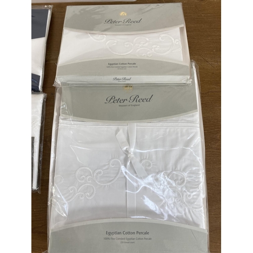 479 - Thirteen sealed Peter Reed bed linen sets