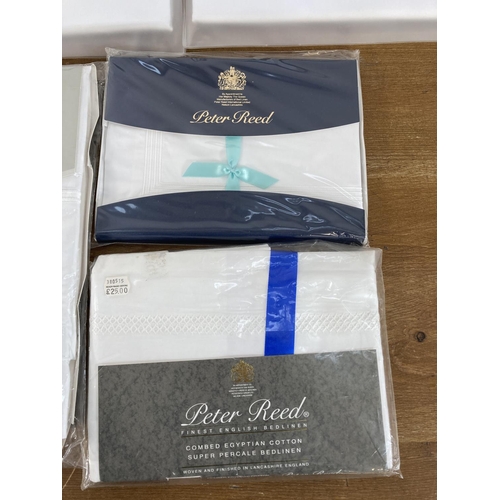 479 - Thirteen sealed Peter Reed bed linen sets