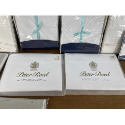 479 - Thirteen sealed Peter Reed bed linen sets