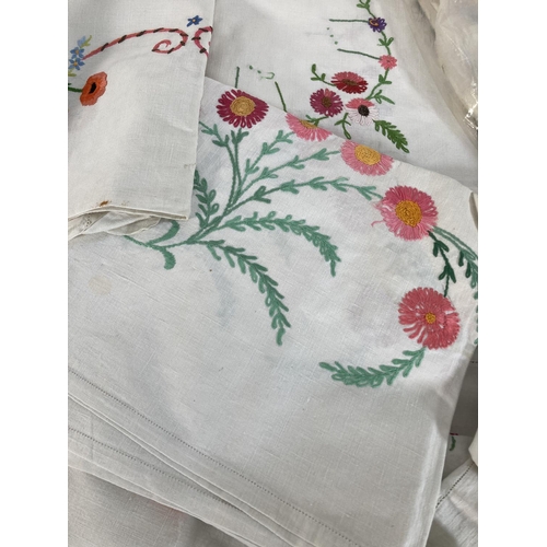 485 - A large collection of vintage embroidered linen