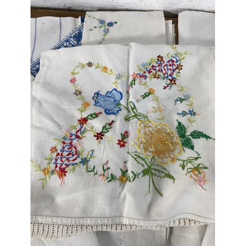 485 - A large collection of vintage embroidered linen