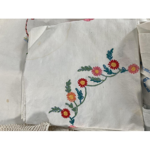 485 - A large collection of vintage embroidered linen