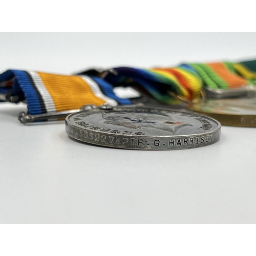 2358 - A British medal group comprising WWI war medal presented to 306227 Pte. G. Harrison Lan. Fus., WWI V... 