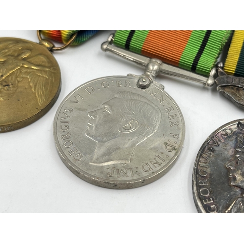 2358 - A British medal group comprising WWI war medal presented to 306227 Pte. G. Harrison Lan. Fus., WWI V... 