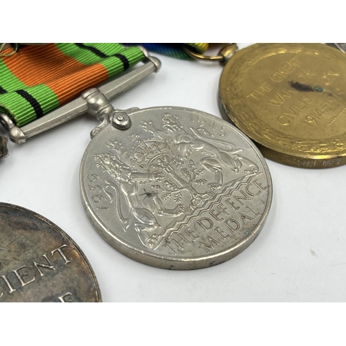 2358 - A British medal group comprising WWI war medal presented to 306227 Pte. G. Harrison Lan. Fus., WWI V... 