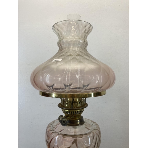 542 - A Victorian Duplex brass oil lamp with pink glass reservoir and shade - approx. 66cm high