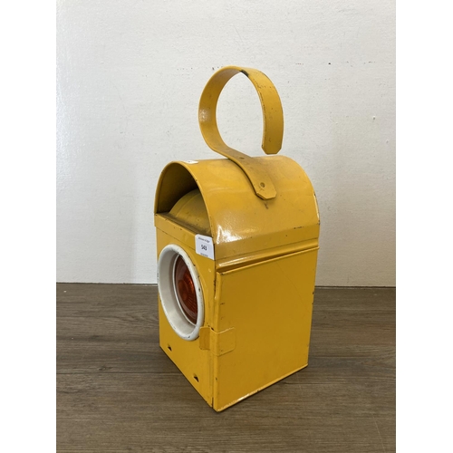 543 - A mid 20th century yellow painted Kenlite NWG railway lantern