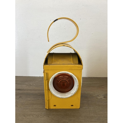 543 - A mid 20th century yellow painted Kenlite NWG railway lantern