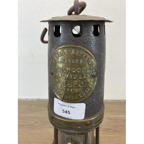 545 - An antique Hailwoods Type 01 Improved brass miner's lamp - no. 1630 - approx. 26cm high