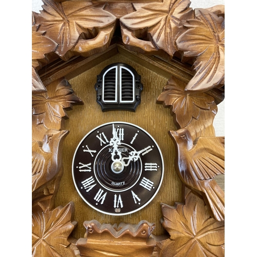 557 - A late 20th century Kaiser quartz cuckoo clock