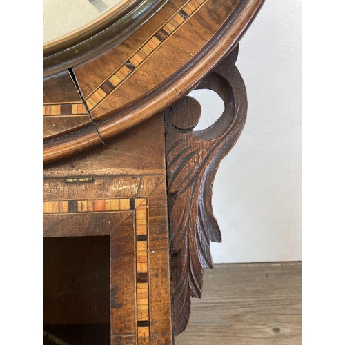 563 - A Victorian inlaid walnut chiming wall clock with white painted face and black Roman numerals