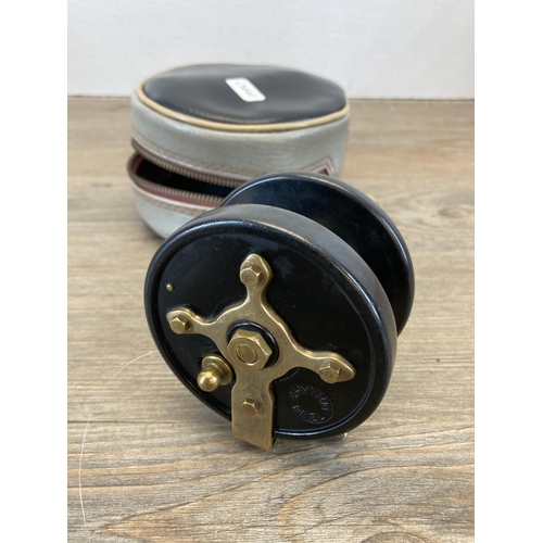 574 - Three antique and later centre pin fishing reels