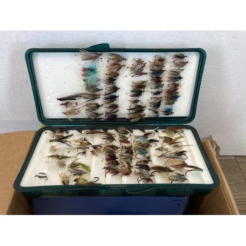 575 - A large collection of fishing accessories to include flies, fly tying equipment, lures etc.