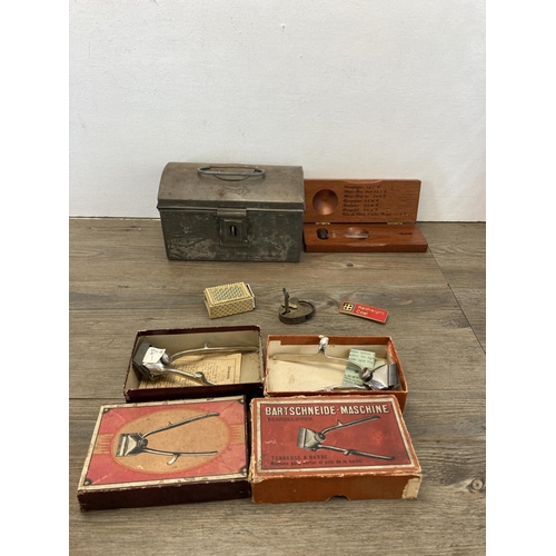 576 - A collection of items to include two vintage boxed hair clippers, oak cased taxidermy butterfly, vin... 