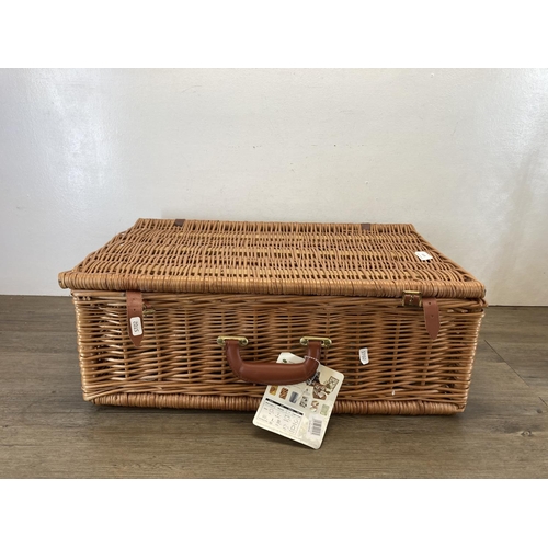 577 - A mid 20th century style Optima wicker picnic basket and contents