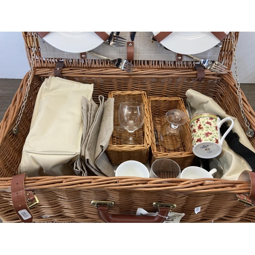 577 - A mid 20th century style Optima wicker picnic basket and contents