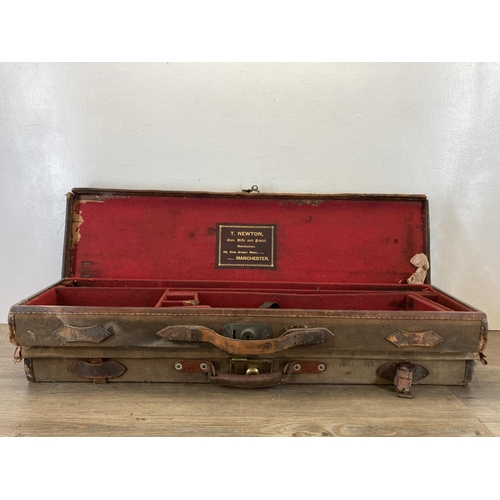 580 - Two early 20th century canvas rifle cases, one being T. Newton of Manchester