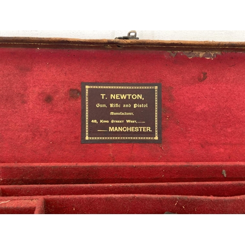 580 - Two early 20th century canvas rifle cases, one being T. Newton of Manchester