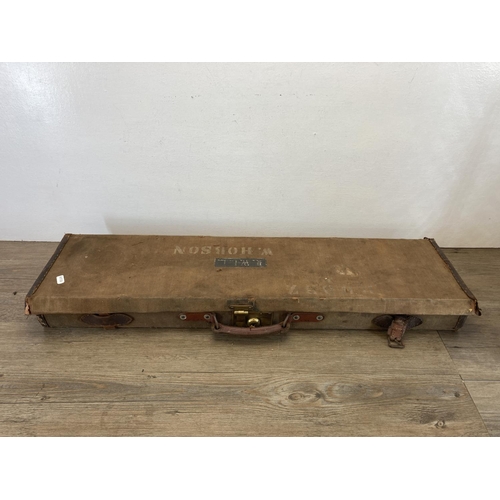 580 - Two early 20th century canvas rifle cases, one being T. Newton of Manchester