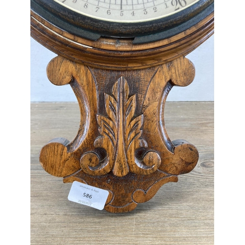 586 - A 19th century Nicholson & Cartner of Carlisle carved oak barometer - approx. 82cm high