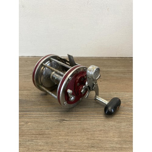 566 - Four vintage multiplier fishing reels, three Penn and one other.