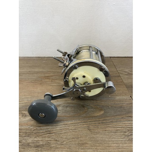 567 - Two vintage Mitchell 624 multiplier fishing reels together with one spare spool