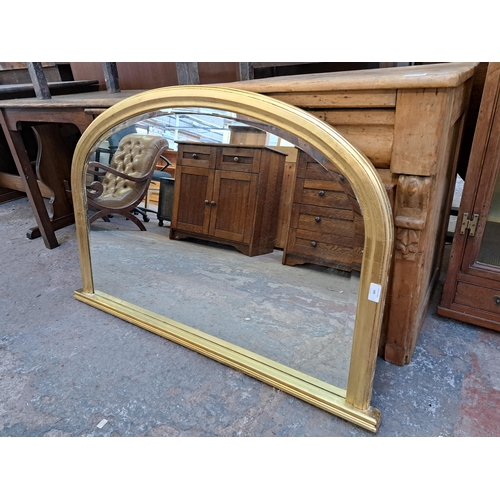 195 - A 19th century style gilt framed bevelled edge over mantle mirror - approx. 73cm high x 114cm wide