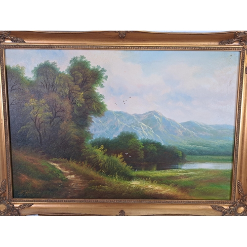 216 - A framed Andrew Grant Kurtis M . A. oil on canvas of a landscape scene - approx. 60cm high x 85cm wi... 