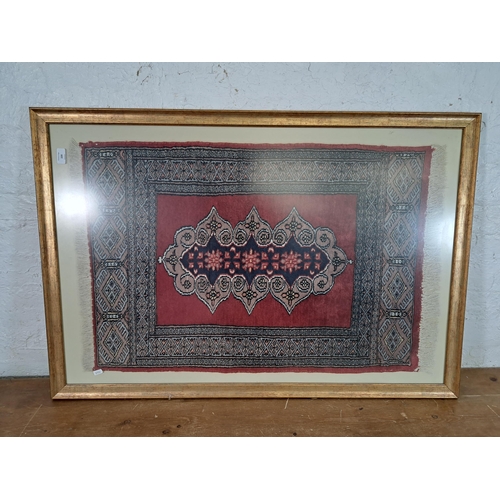 220 - A framed Persian rug - approx. 114cm high x 77cm wide