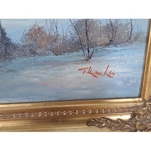 210A - A gilt framed oil on canvas of a winter landscape scene signed lower right - approx. 73cm high x 105... 