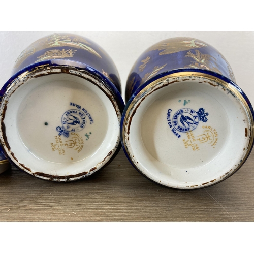 239 - A pair of W&R Carlton Ware Kang Hsi jars and covers - approx. 27cm high