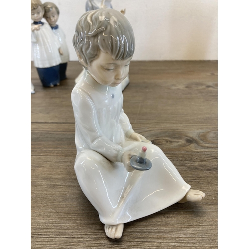 260 - Five Spanish porcelain figurines to include three Nao by Lladro etc.