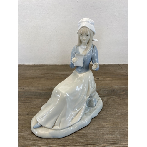 260 - Five Spanish porcelain figurines to include three Nao by Lladro etc.