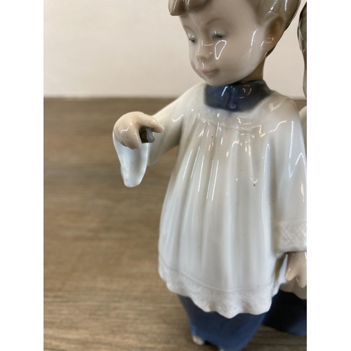 260 - Five Spanish porcelain figurines to include three Nao by Lladro etc.