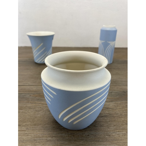 262 - Three Wedgwood Symmetry pattern pale blue Jasperware vases - largest approx. 12cm high