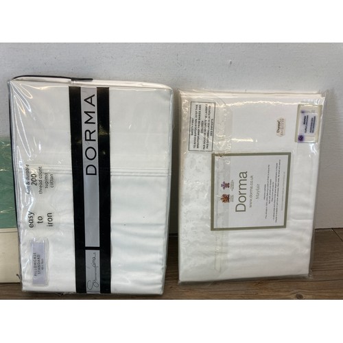 484 - A collection of sealed bed and table linen to include The White Company 100% cotton Milano pillow ca... 